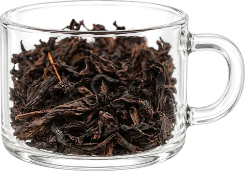 Lotus Peak Rougui: dark twisted dry leaves in a low handled display glass