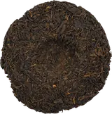 Unwrapped Vietnamese old-tree shu pu-erh tea cake